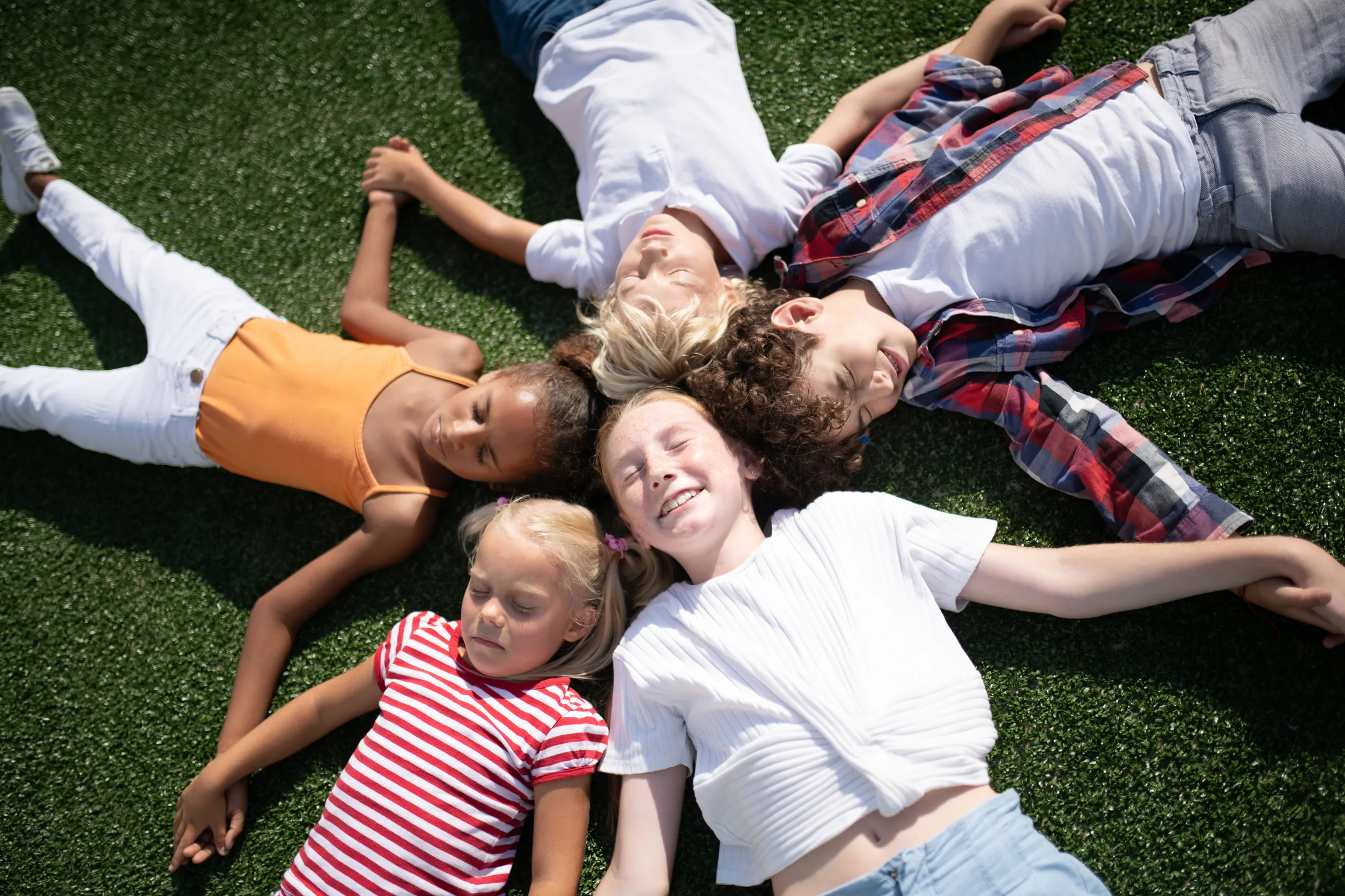 Diverse group of children welcoming you to Children's Development UK