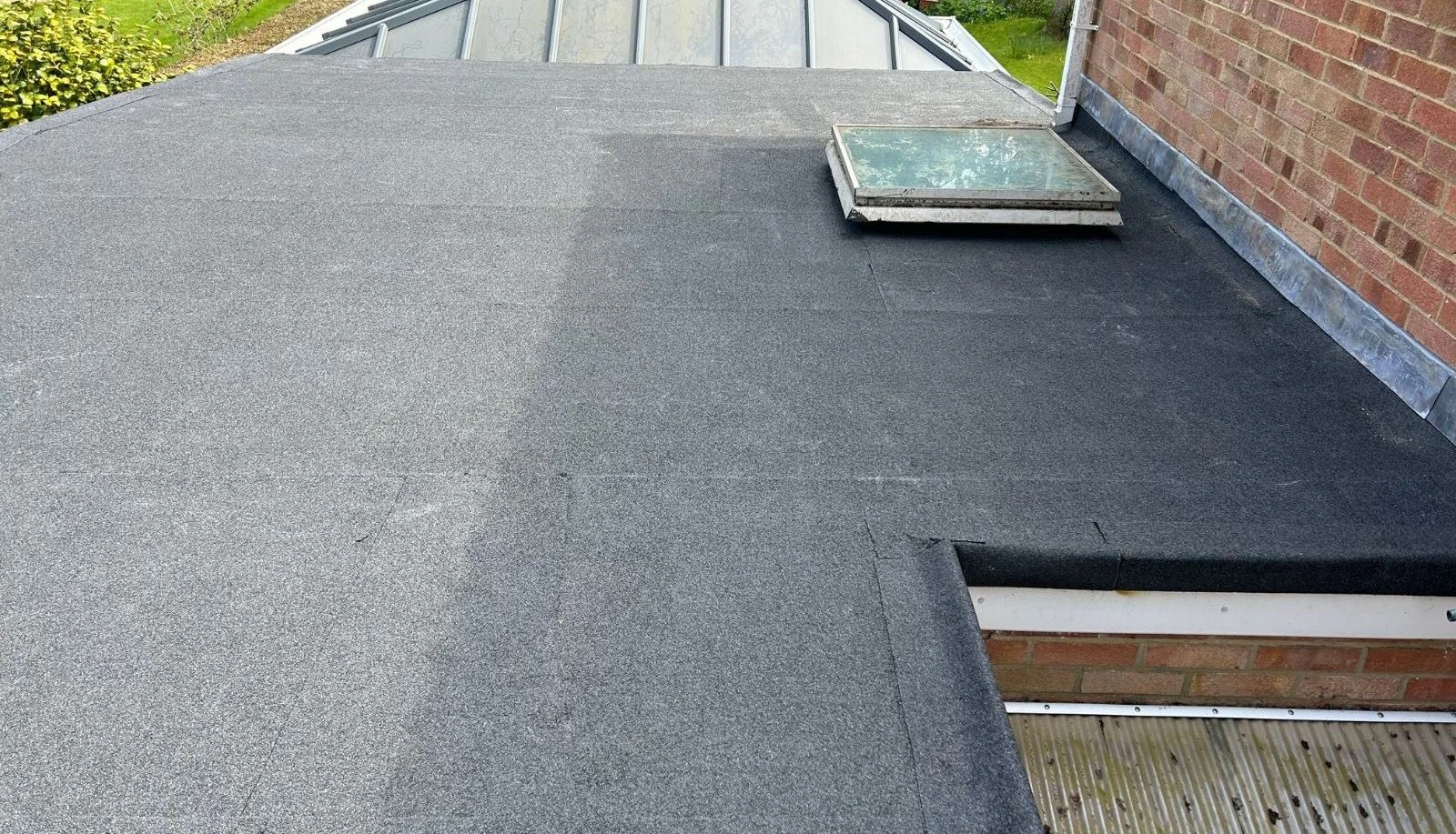 Newly refurbished flat roof with fresh felt installation